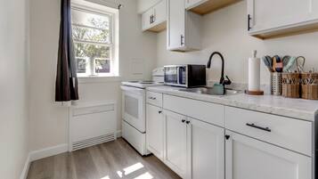 Fridge, microwave, stovetop, coffee/tea maker