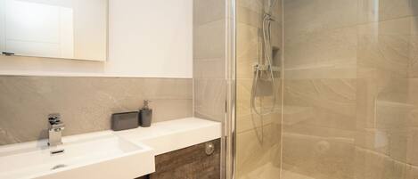 Shower, towels, toilet paper