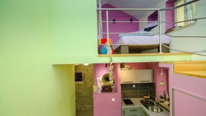 A compact, two-story apartment with a kitchen on the ground floor and a bedroom on the upper floor. - Apartments Urban Stone Escape (Split)