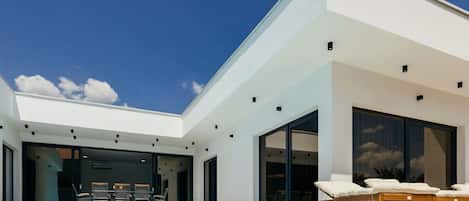 Outdoor pool, a heated pool, open open 24 hours, pool umbrellas