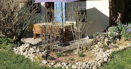 Deceptively spacious, comfy cottage. Private garden, patio, balcony and stream