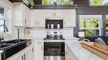 Oven, stovetop, cookware/dishes/utensils, dining tables