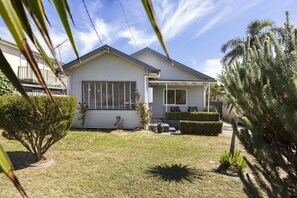 A single-story house with a front porch, a small front yard, and a clear sky. - Sherbrooke, Rosebud. (Rosebud)