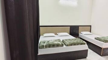 Deluxe Triple Room, Non Smoking, Private Bathroom | Desk, laptop workspace, free WiFi