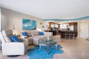 Living area - Relax in this ground-floor 2BR condo in New Smyrna Beach with a private patio, lush lawn, and direct pool and beach access just steps away. (New Smyrna Beach)