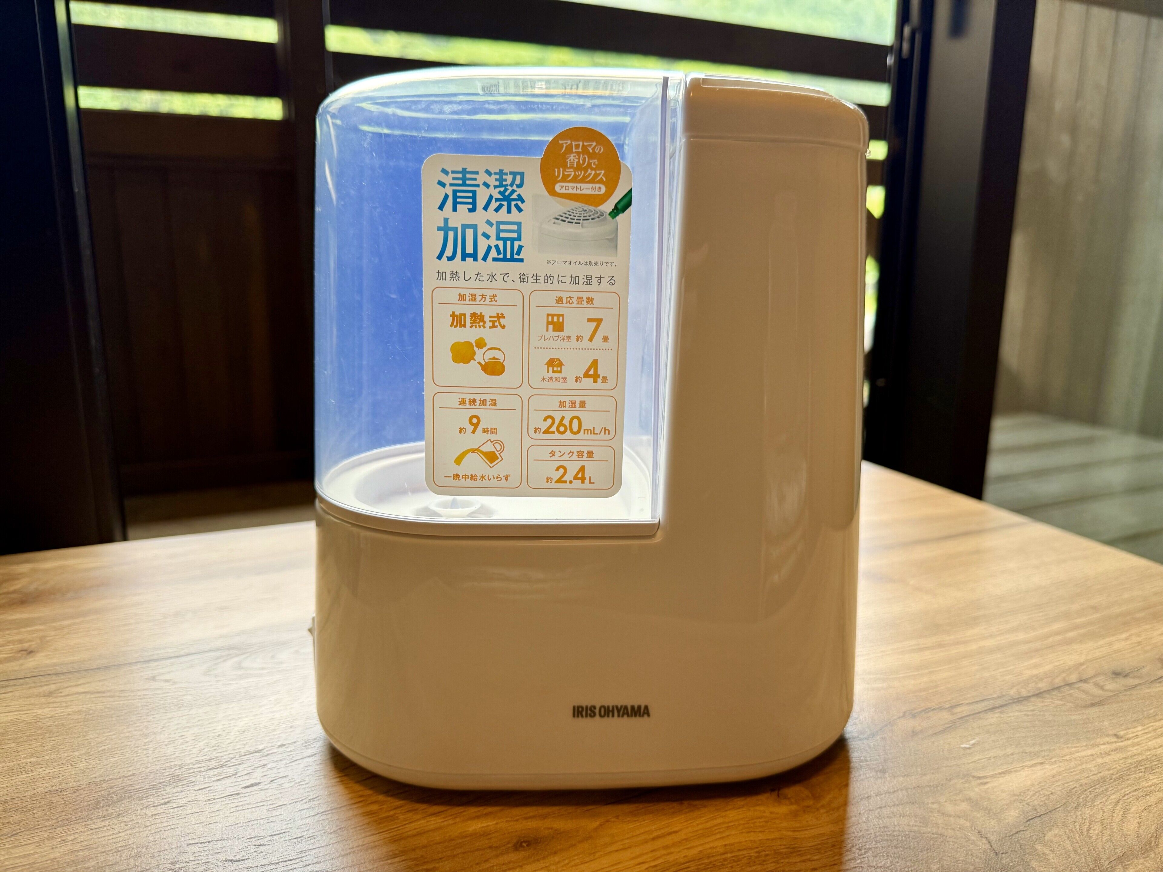 A water dispenser with a label detailing its features.