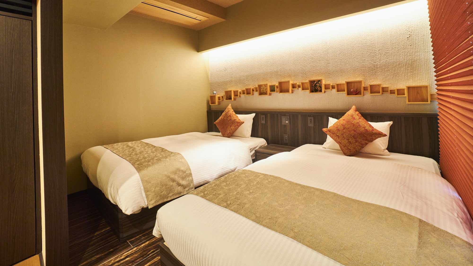 A hotel room with two beds, a wooden headboard, a textured wall, and a ceiling light.