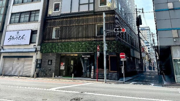 A multi-story hotel with a prominent 'HOTEL REFERENCE' sign, a ground-level cafe, and a visible entrance. - Hotel Reference Kokura Ekimae (Kitakyushu)