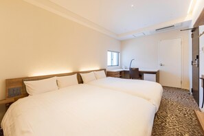 A hotel room with two beds, a desk, a chair, and a wardrobe. - Tabi And Nagasaki (Nagasaki)