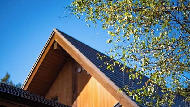A wooden building with a sloped roof and a visible attic space. - Yunni no Yu (Yuni)