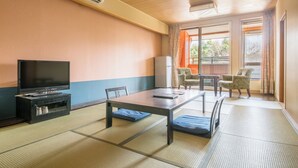 A room with tatami flooring, a television, a table, chairs, and a view through a large window. - Yunni no Yu (Yuni)