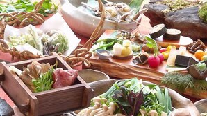 A variety of food items and utensils on a table. - Shibu Tatsunokan (Chino)