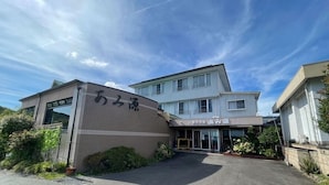 A two-story building with a sign that reads 'あみ源' and another sign above the entrance. - Amigen (Toba)