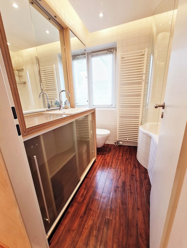Shower, hair dryer, towels, toilet paper