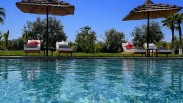 Outdoor pool, free pool cabanas, pool umbrellas