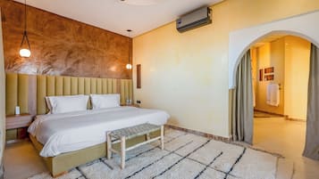 Premium bedding, free minibar items, in-room safe, laptop workspace
