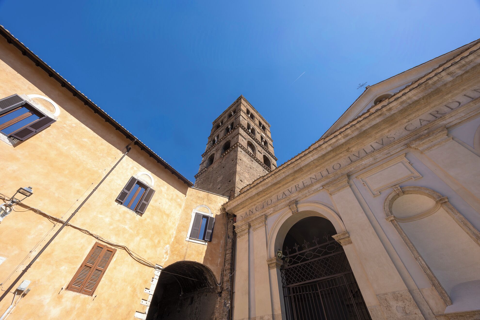 A building with a tower and arched windows.