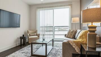 Apartment, 2 Bathrooms (2 Bedrooms) | Living area | 50-inch TV with digital channels