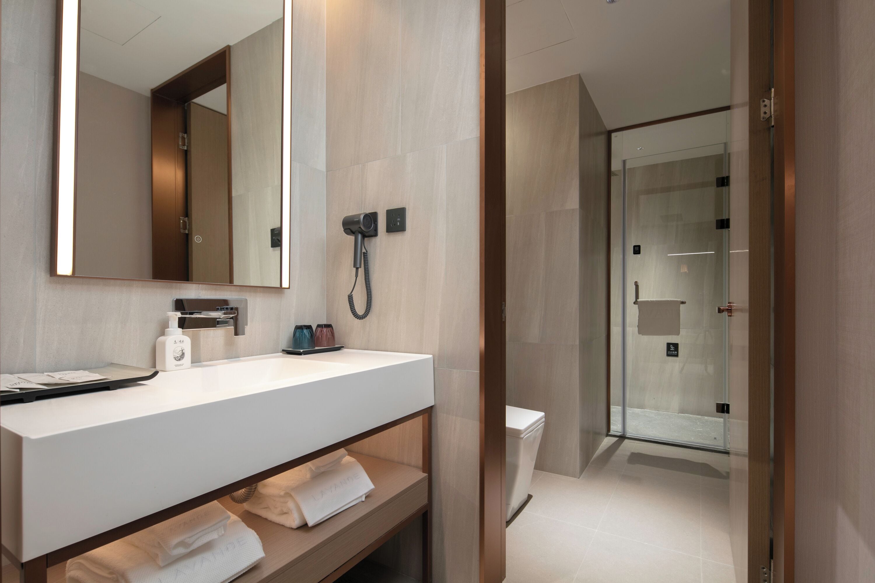 Shower, hair dryer, towels, shampoo