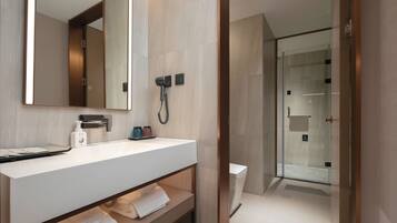 Shower, hair dryer, towels, shampoo