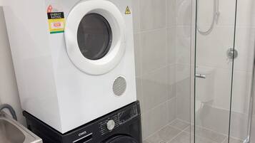 Shower, hair dryer, towels