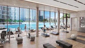 A modern gym with a pool view, exercise equipment, and a spacious layout. - Maison Privee - Modern Family Retreat w/ Dubai Skyline Views (Dubai)