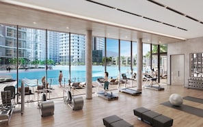 A modern gym with a pool view, exercise equipment, and a spacious layout. - Maison Privee - Modern Family Retreat w/ Dubai Skyline Views (Dubai)