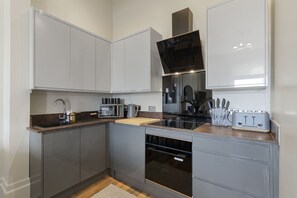 Private kitchen - Sea Breeze is a stylish two-bedroom luxury coastal apartment (Teignmouth)