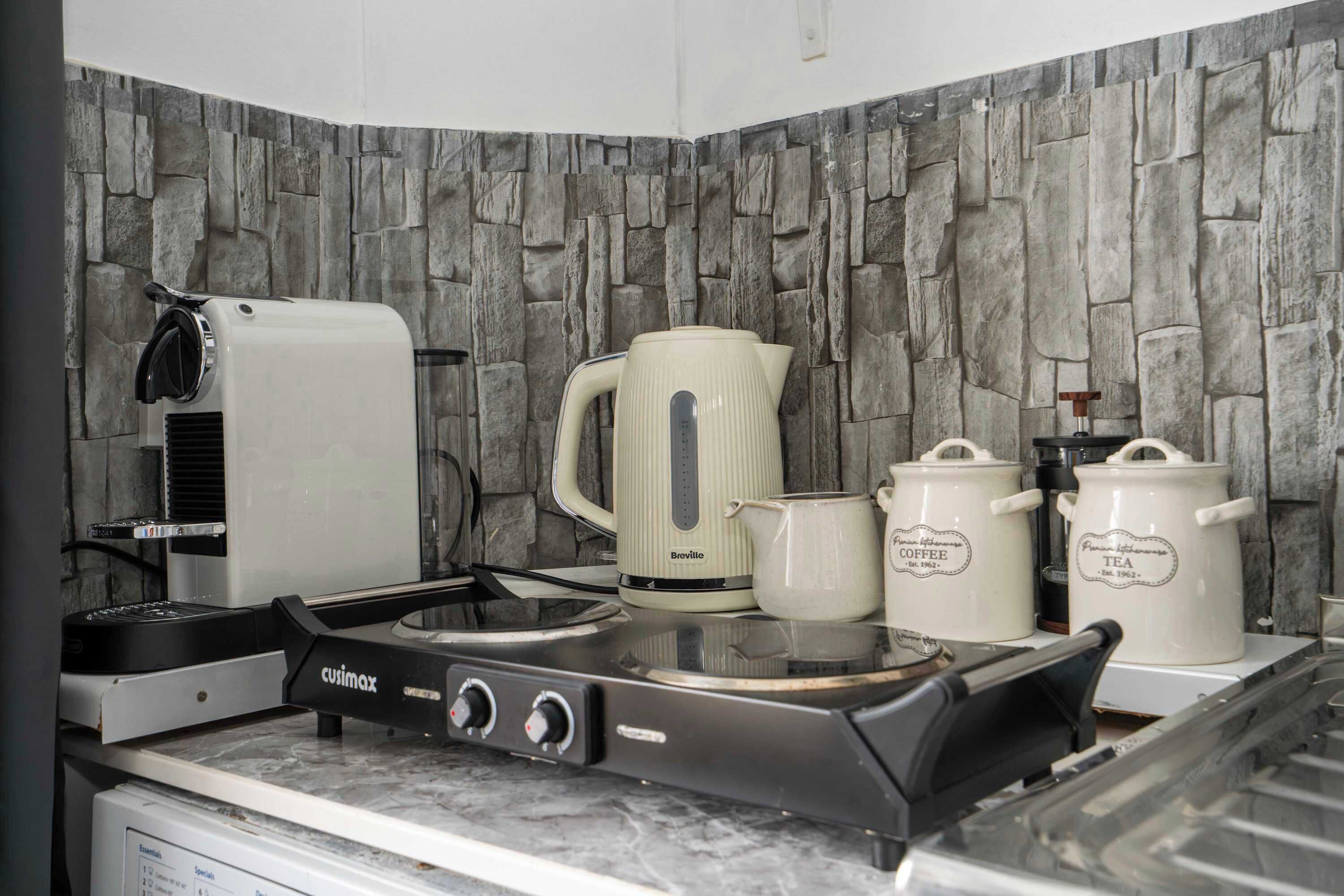 Microwave, stovetop, coffee/tea maker, electric kettle