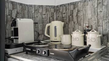 Microwave, stovetop, coffee/tea maker, electric kettle