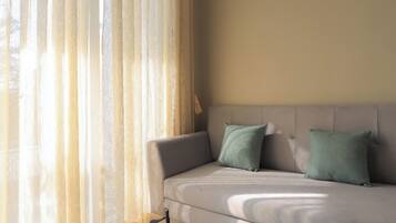Luxury Room | Living area | 32-inch LED TV with cable channels