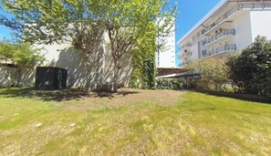 Apartment, 2 Bedrooms, Garden View | Property grounds - Bright Accommodation With Shared Garden in Lignano (Lignano Sabbiadoro)