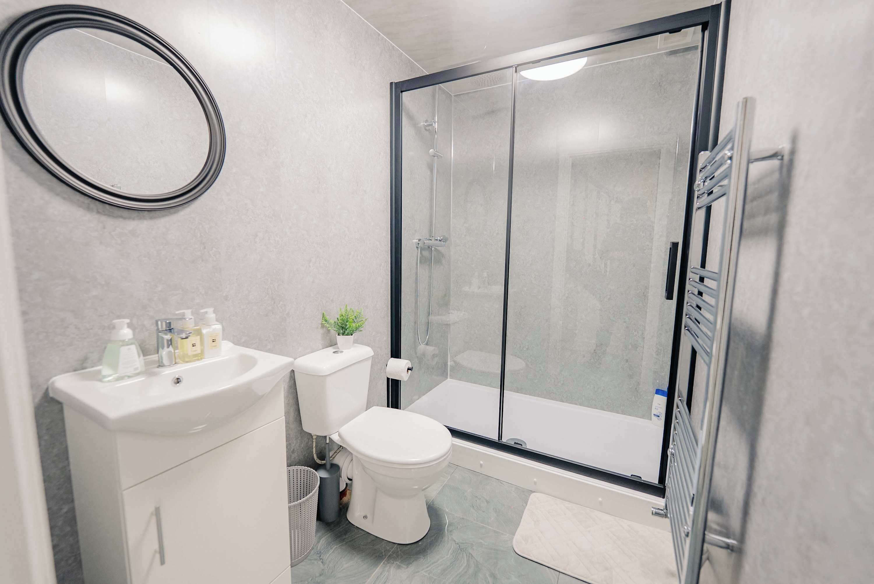 Shower, hair dryer, towels, shampoo