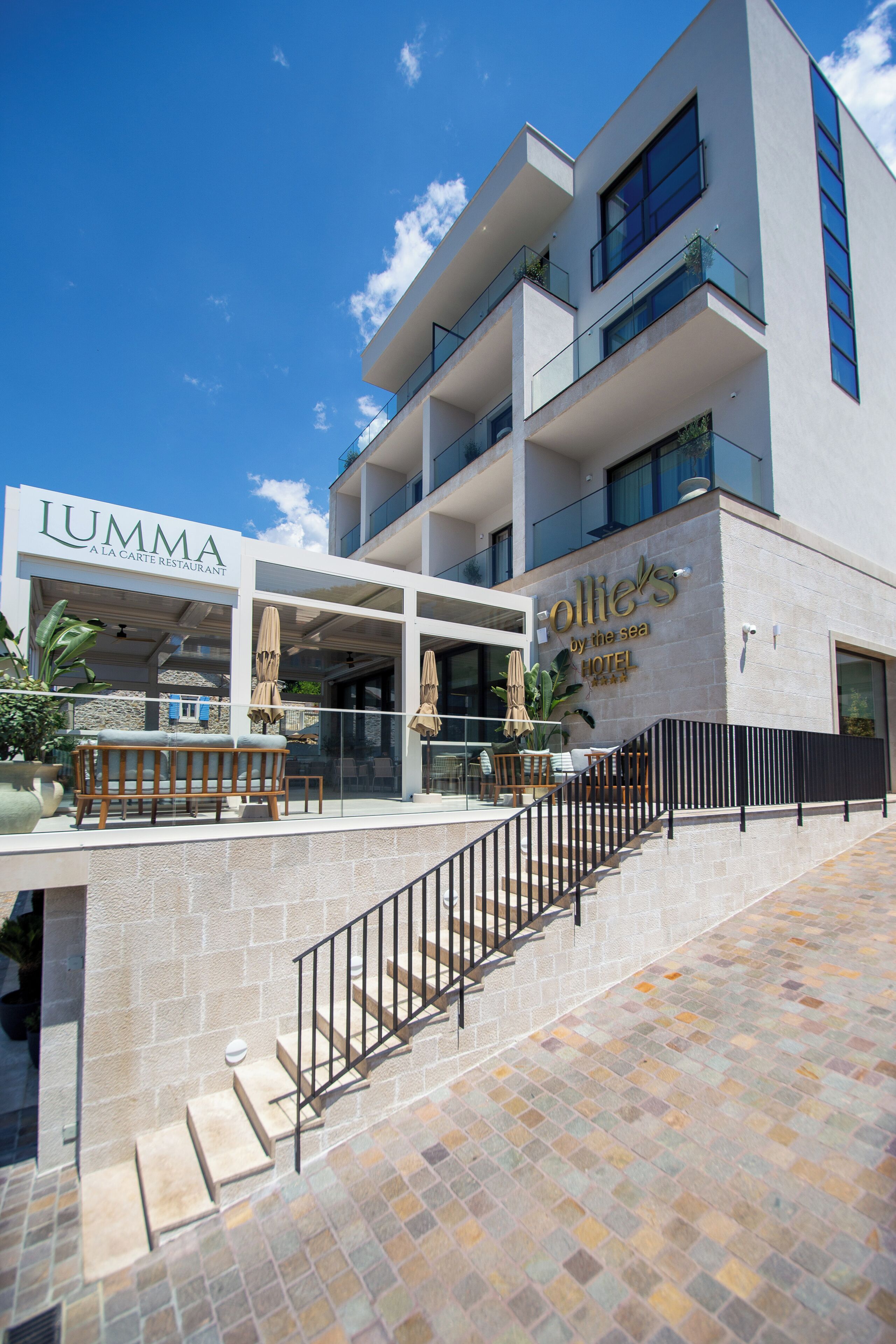 A modern hotel with a restaurant named 'Lumma' and a hotel named 'Collie's by the sea.'