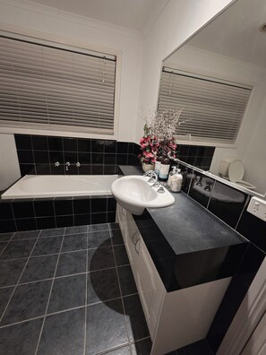Shower, jetted tub, towels, soap