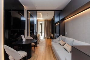 Apartment | Living area | 50-inch Smart TV with cable channels - VivimiHome- The B Suite (Milan)