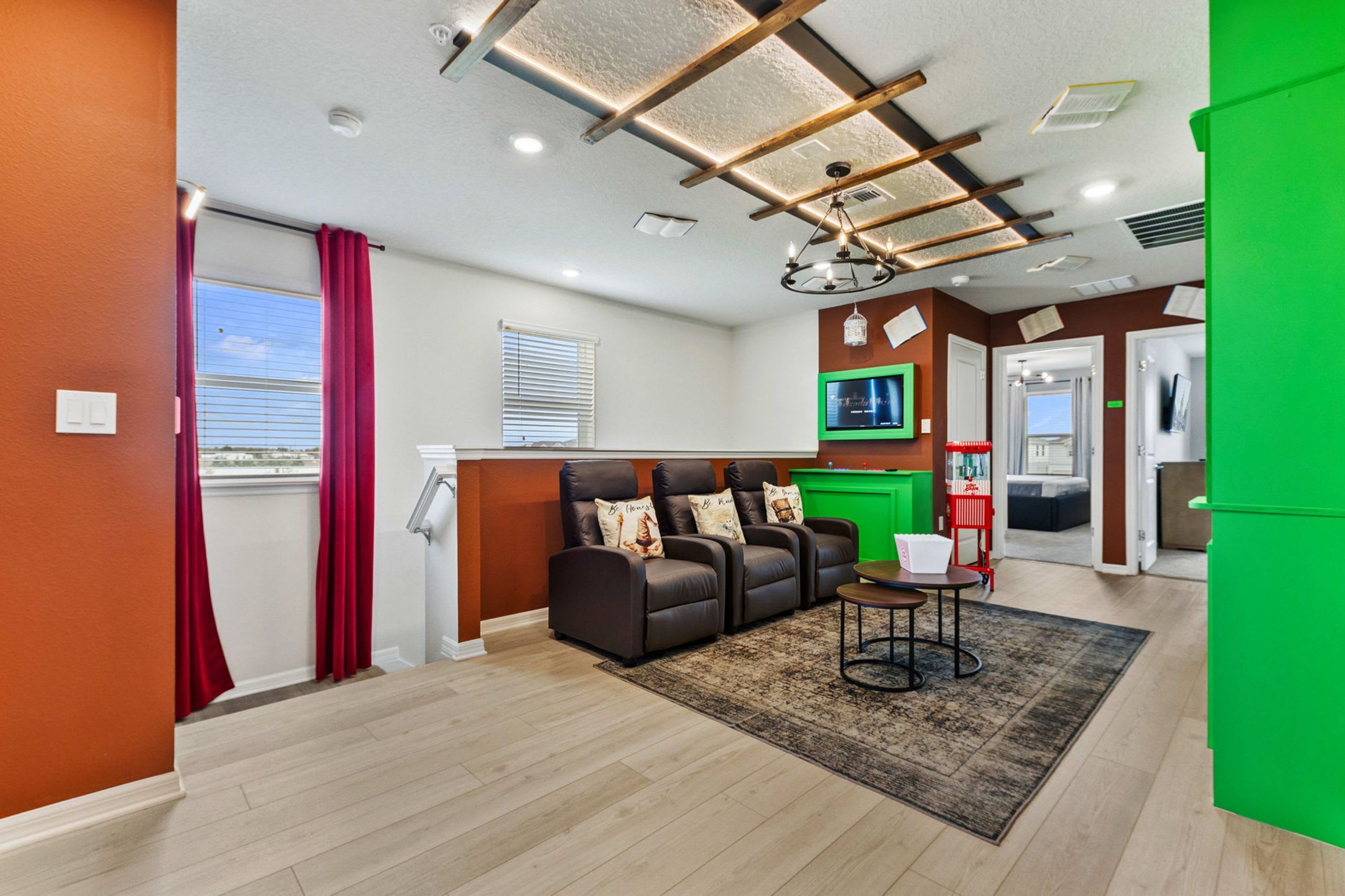 A living room with a sofa, a small table, and a television.