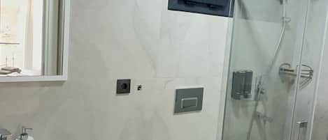 Shower, hair dryer, towels, soap