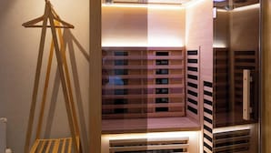 A modern storage unit with multiple compartments, a wooden ladder, and a glass door.