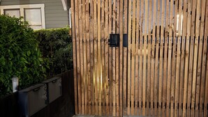 A wooden fence with a metal gate, a concrete pathway, and a hedge. - Brand New next to Balboa Park, near Little Italy (San Diego)