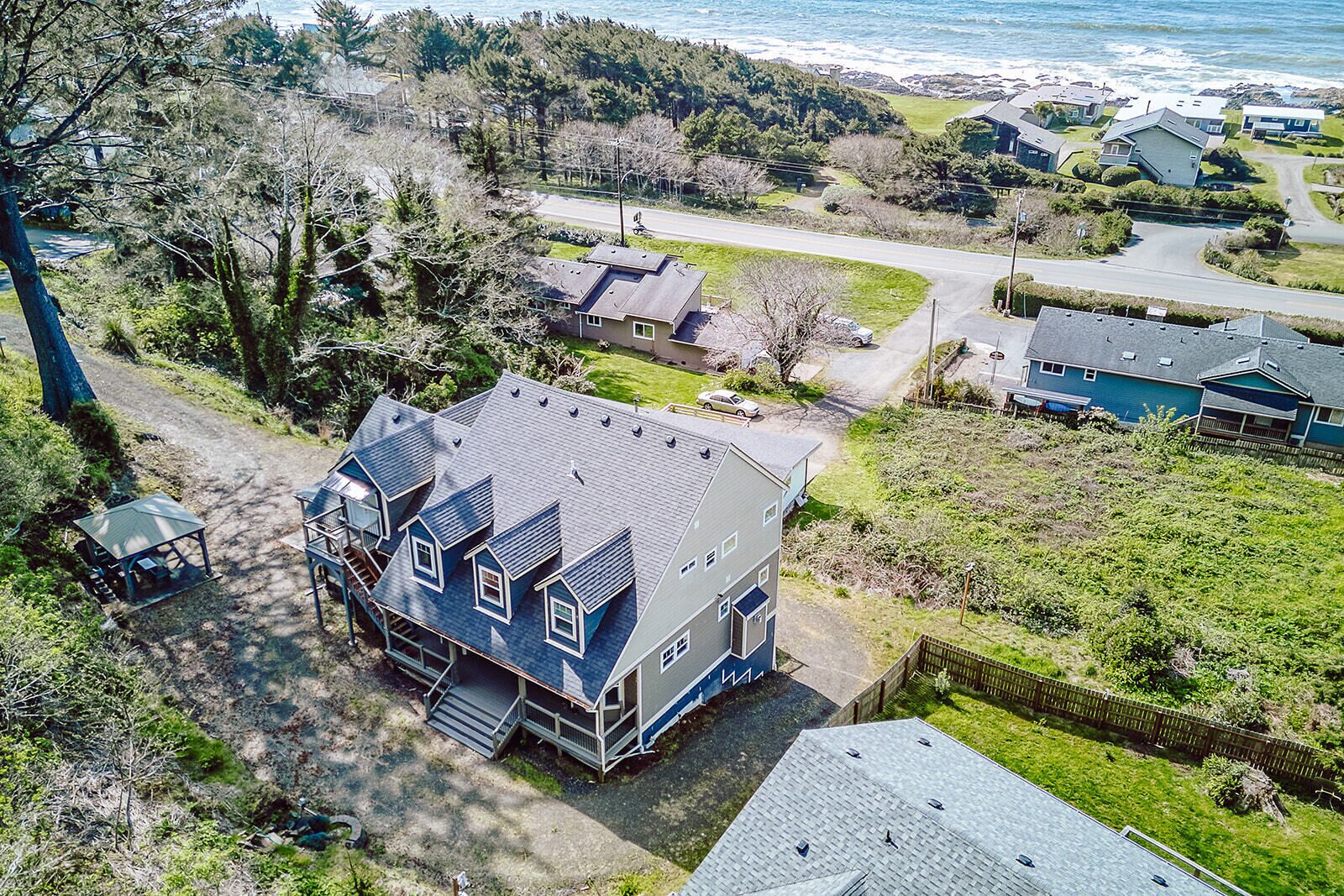 Coastal retreat nestled between forest and ocean, offering peaceful seclusion with easy beach access in a charming seaside community.