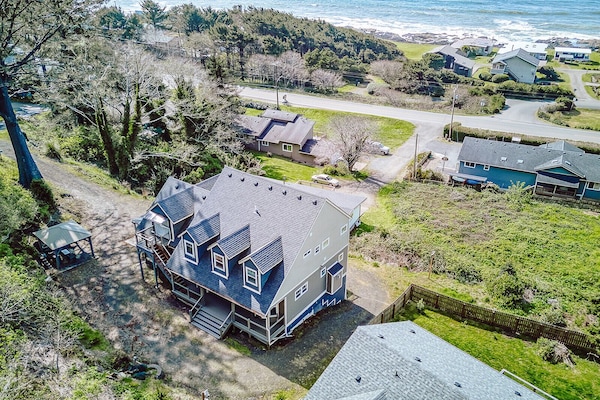 Coastal retreat nestled between forest and ocean, offering peaceful seclusion with easy beach access in a charming seaside community.