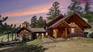 A log cabin with a porch, a chimney, and a small deck. - Historical Crocker Ranch - Rowe House 23-zone3423 3 Bedroom Home (Drake)