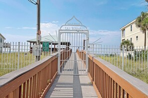 A gated entrance to a property named 'Gulf Pines' with a sign reading 'TA1 MAHAL'. - Coastal Retreat with Private Beach Access less than 50ft from home (Miramar Beach)