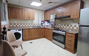 Comfort Apartment, Balcony, Beach View | Private kitchen - Noor Al Amal Real Estate (Sharjah)