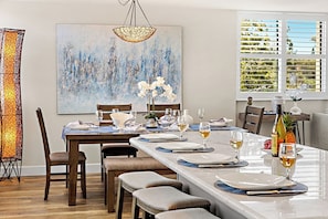 Gather around your elegant dining space, where thoughtful place settings and artistic touches create the perfect atmosphere for memorable meals together. - 2 Bedroom Partial Ocean View RK520 (Lahaina)