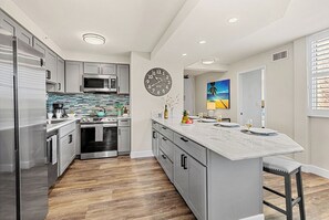 Your fully equipped kitchen features modern appliances and a spacious island where you can prep meals or enjoy casual dining together. - 2 Bedroom Partial Ocean View RK520 (Lahaina)