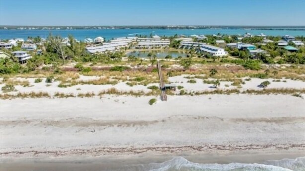 A coastal resort with beachfront properties, a pool, and a clear view of the ocean. - Welcome to your slice of paradise on Little Gasparilla Island (Placida, Little Gasparilla Island)