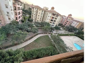 Property grounds - Luxurious Pool View Apartment – Elegant 2BR in Dreamland Compound (Giza Governorate)