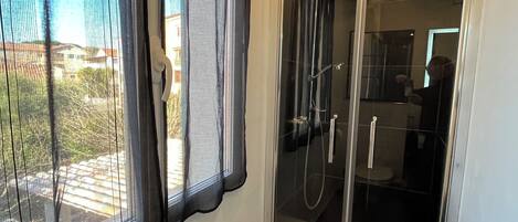 Shower, hair dryer, towels, soap